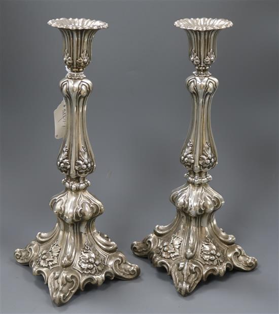 An ornate pair of Scandinavian? 830 standard white metal candlesticks, gross 31 oz.